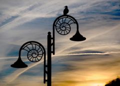 Ammonite lamp post at dusk, Lyme Regis - © MichaelMaggs - License CC-BY-SA 3.0